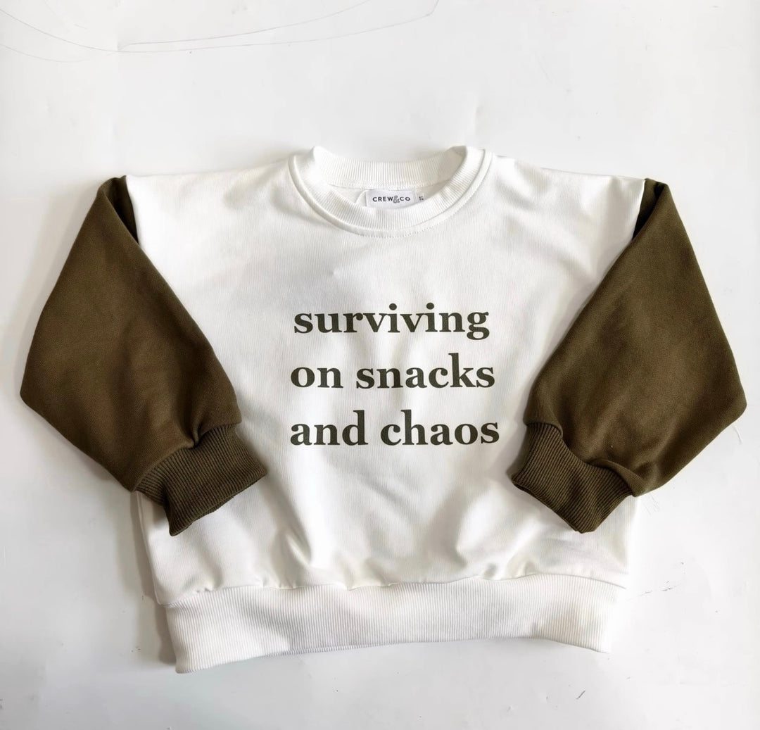 “Surviving on snacks and chaos” crewneck